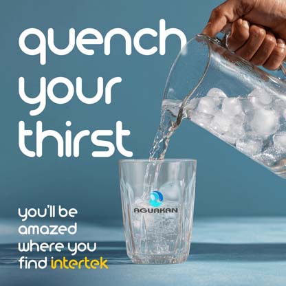 Ice water being poured from a pitcher into a glass