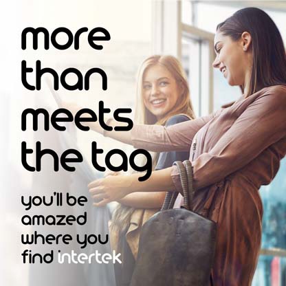 Two women looking at garments at a store