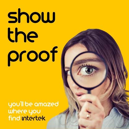 A woman holding a magnifying glass up to her eye